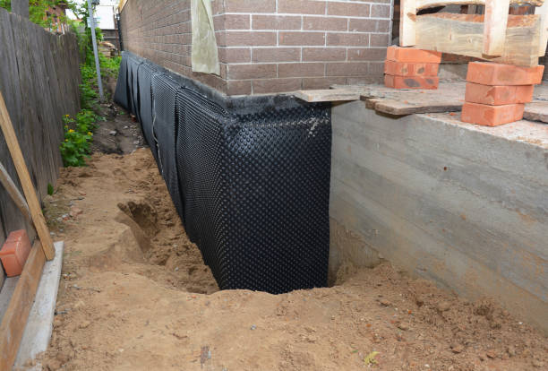SJ Waterproofing Pros technician performing targeted Sump Pump Installation assessment in Bryantown, MD